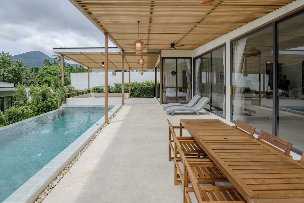 Tropical Poolside Retreat by Sea N' Rent
