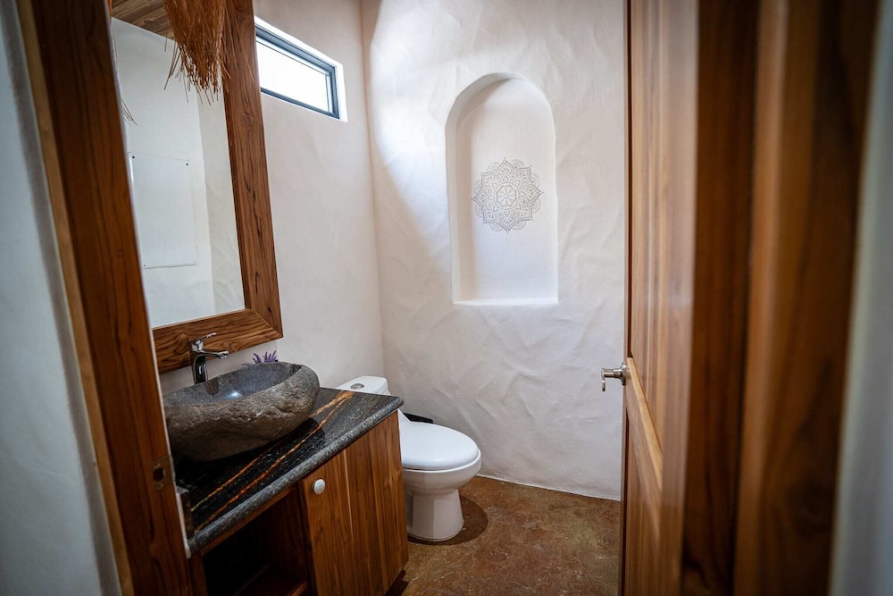 Bohemian Tropical Villa with a Tiki-Style Swimming Pool & Swim-Up Bar with an Attached Studio Apartment