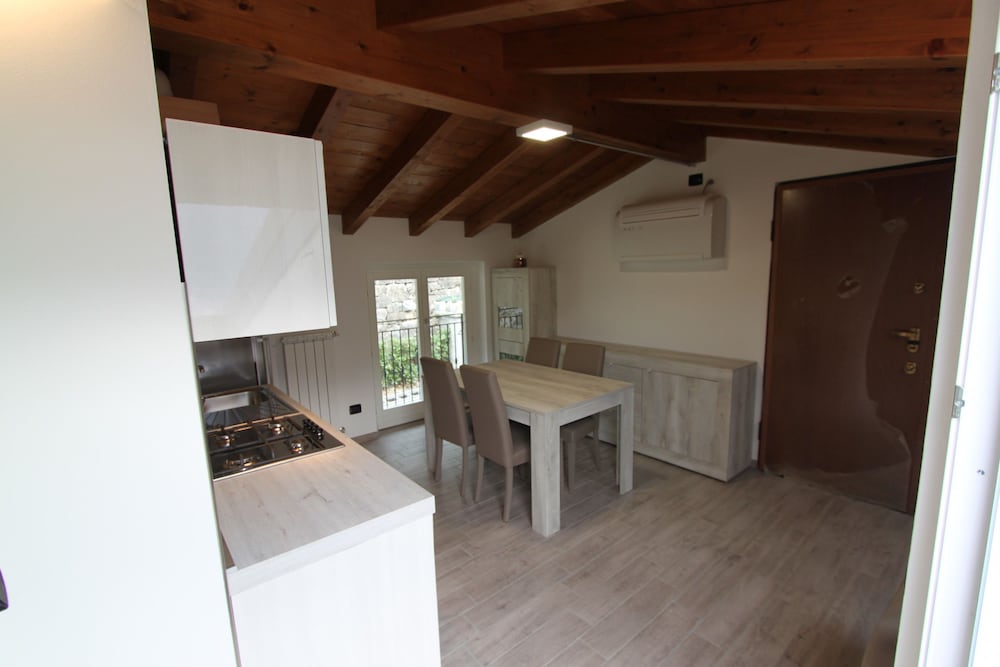 Attic with Pool en Nesso — kitchen