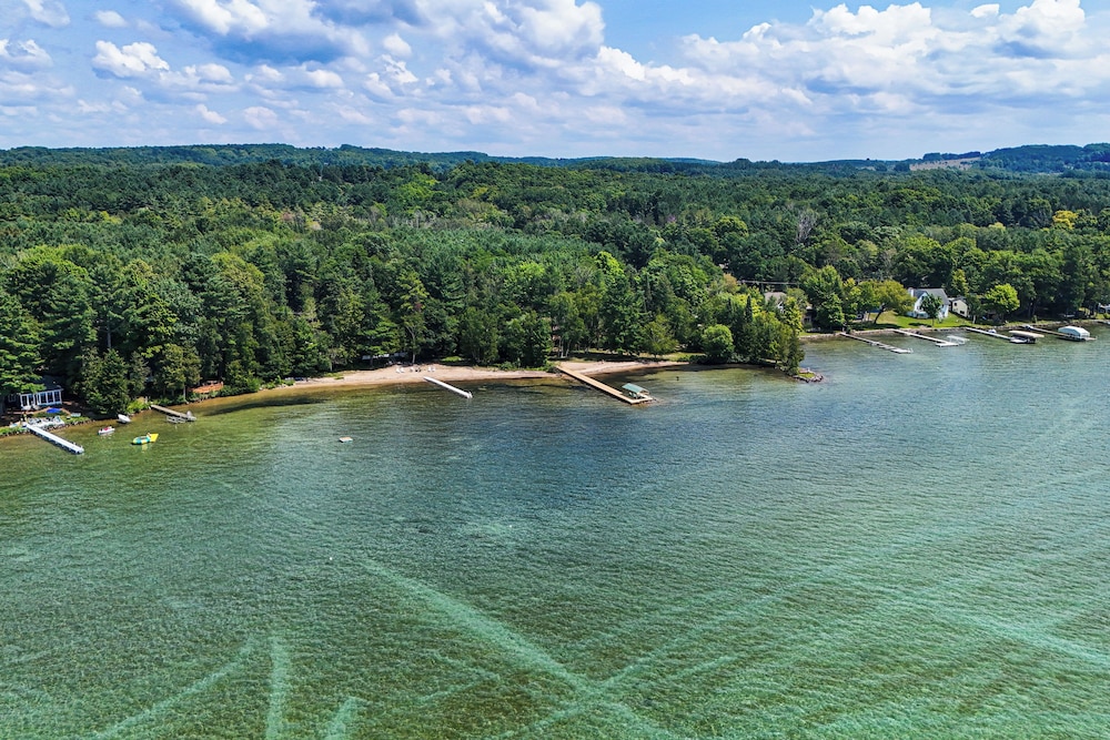 Torch Lake Getaway w/ Private Beach + Boat Dock!