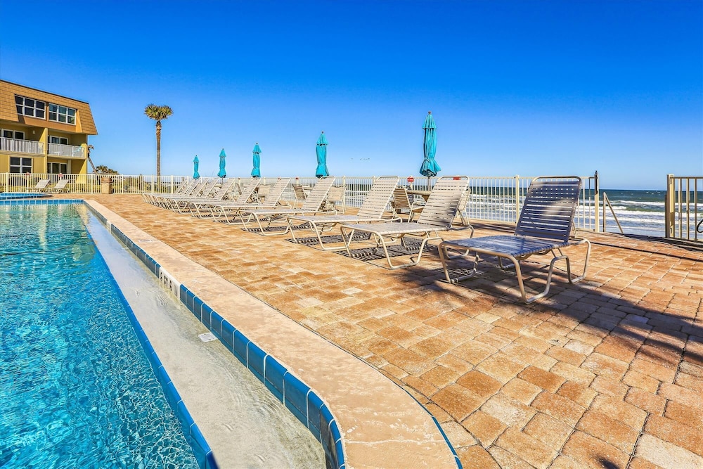 Beachfront Gem: Serene 2BD Haven With Pool & Views