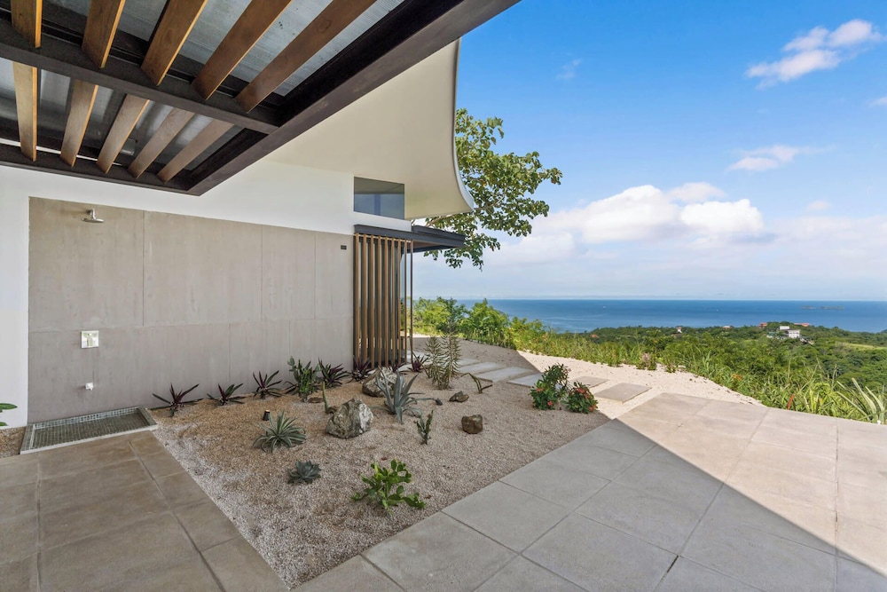 Luxurious Ultramodern Property with Private Suites, Infinity Pool, and Sweeping Ocean and Mountain Views