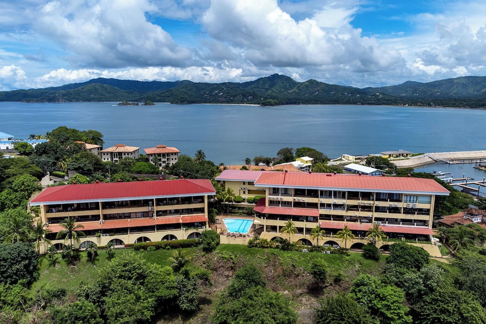 Remodeled Top-Floor Condo with Stunning Wrap-Around Balcony Offering Mountain, Ocean & Marina Views