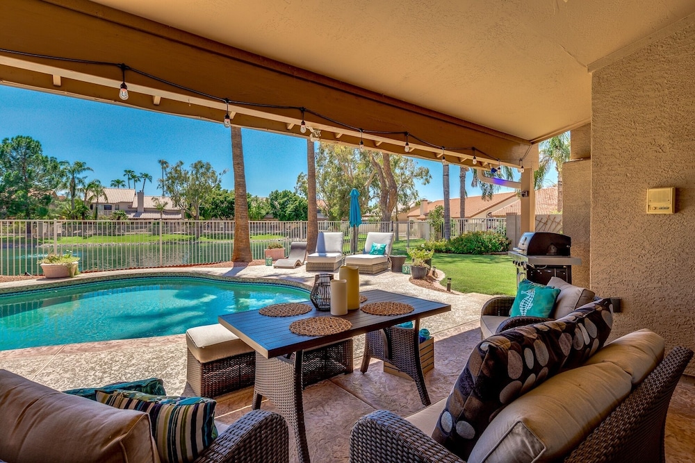 Updated waterfront home w/ private Heated pool & garage. Near Arrowhead shops! by RedAwning in Glendale, US