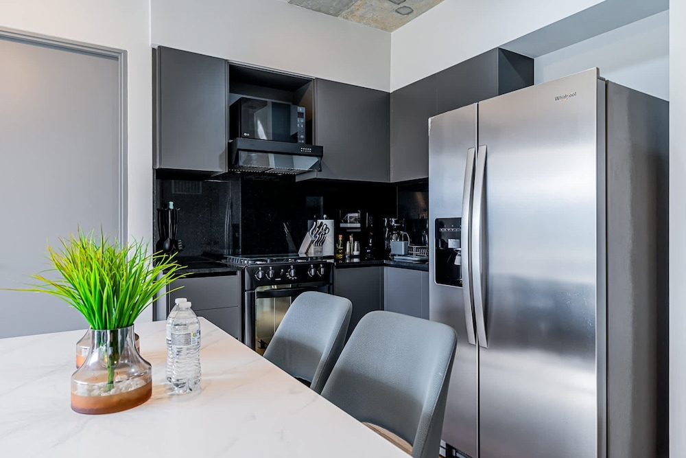 w Elegant 2BR Apartment in the Heart of Centriqo