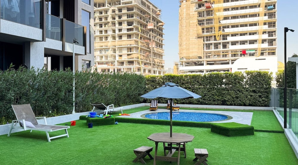 Stylish 1BR Apt w Pool in JVC nr Dubai Sports City