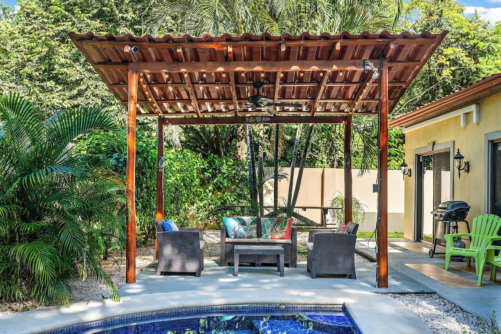 Inviting Home with Colorful Decor and Private Backyard Oasis with a Swimming Pool & Shaded Terrace