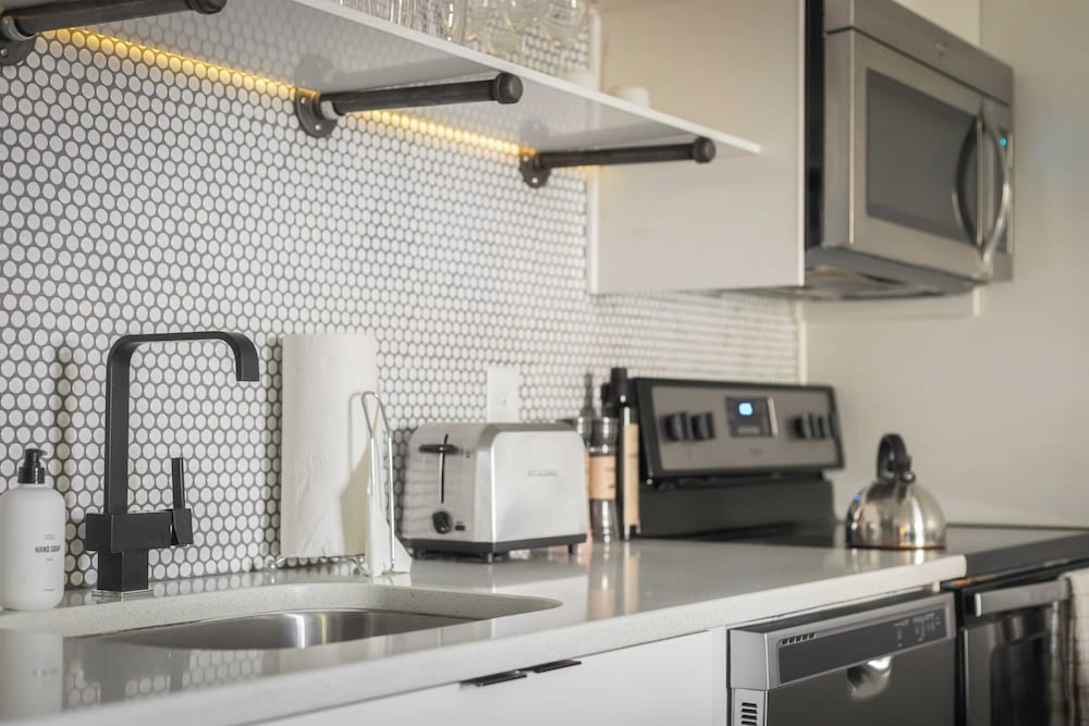 Sleeps 8 Walkable Sobro Suites w/ Local Art & Vibes by Avantstay