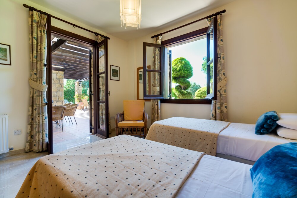3 bedroom Villa Anarita 64 with private L-shaped pool, beautiful gardens, near resort village square view 3