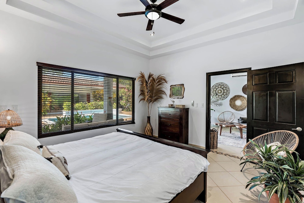 Stylish Home with Chic Decor, Luxury Amenities & Tropical Outdoor Oasis with Sparkling Private Pool