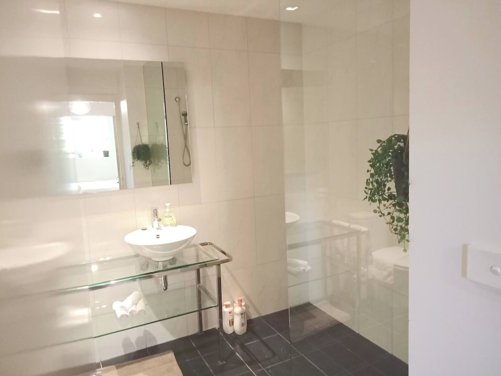Unwind in Style at Melbourne's Historic Art Deco Apartment With Pool Gym Carpark