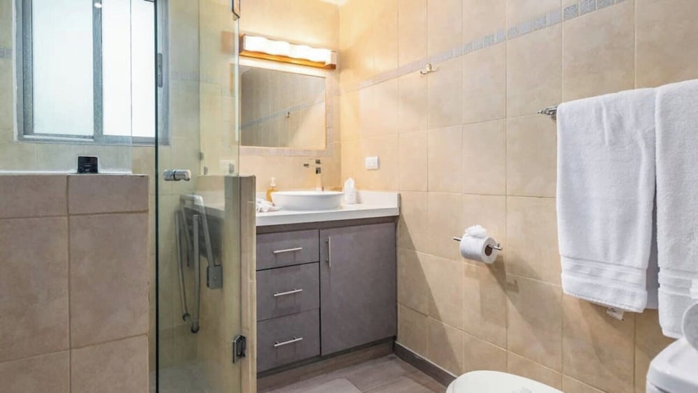 Elegant Condo with Brand-New Fixtures, Shaded Tropical Terrace, and Secluded Beach Access