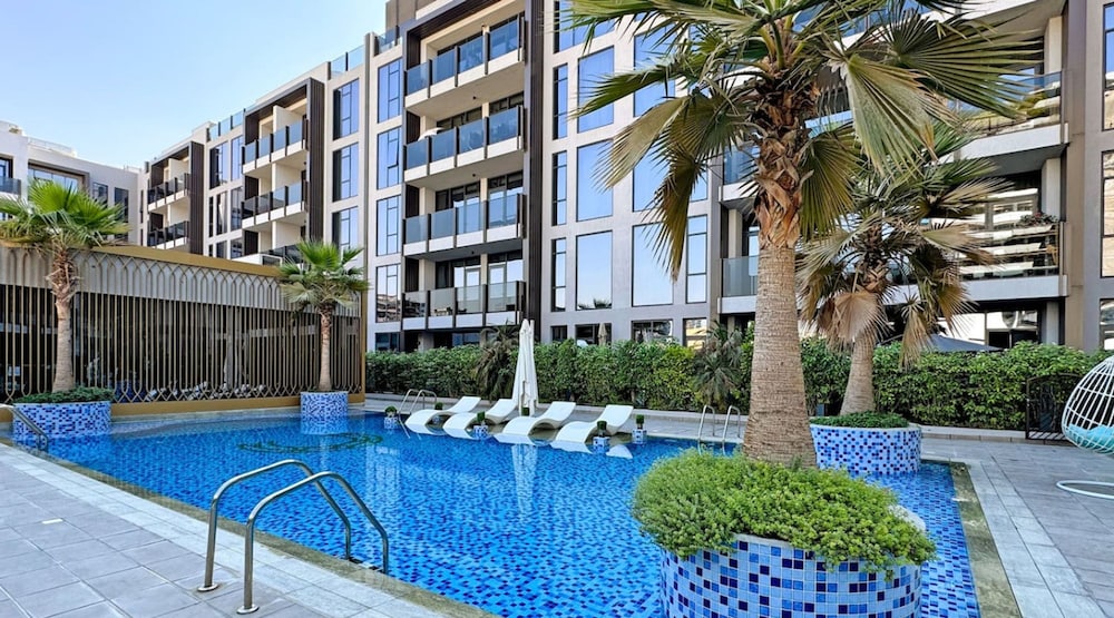 Stylish 1BR Apt w Pool in JVC nr Dubai Sports City