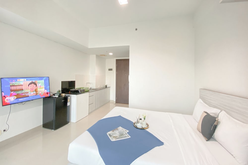 Simple White Designed Studio At Lrt City Bekasi Apartment