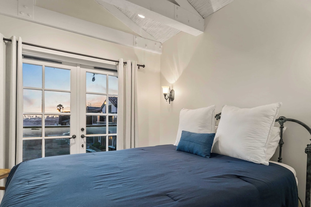 Oceanfront Home Walk to Balboa Pier + Scenic Views Balboa Peninsula Point by Avantstay
