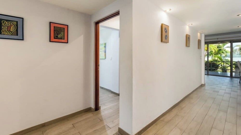 Elegant Condo with Brand-New Fixtures, Shaded Tropical Terrace, and Secluded Beach Access