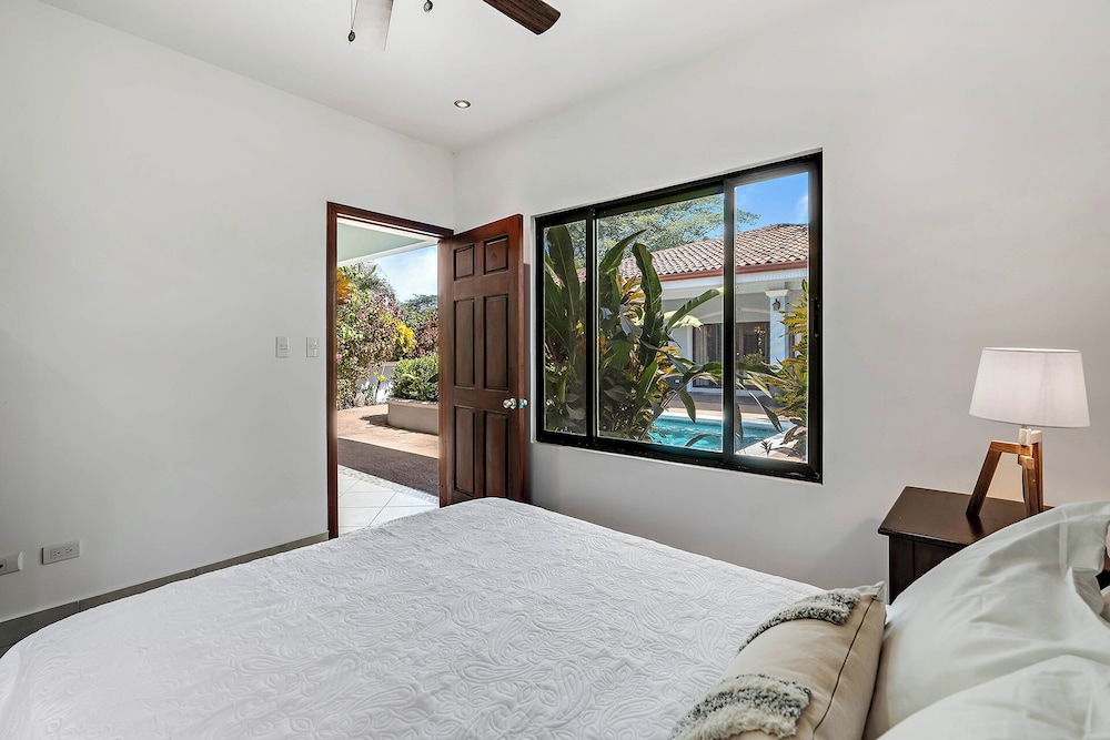 Stylish Home with Chic Decor, Luxury Amenities & Tropical Outdoor Oasis with Sparkling Private Pool