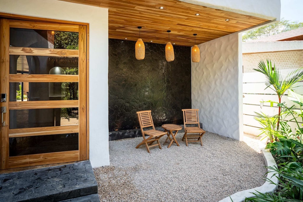 Bohemian Tropical Villa with a Tiki-Style Swimming Pool & Swim-Up Bar with an Attached Studio Apartment