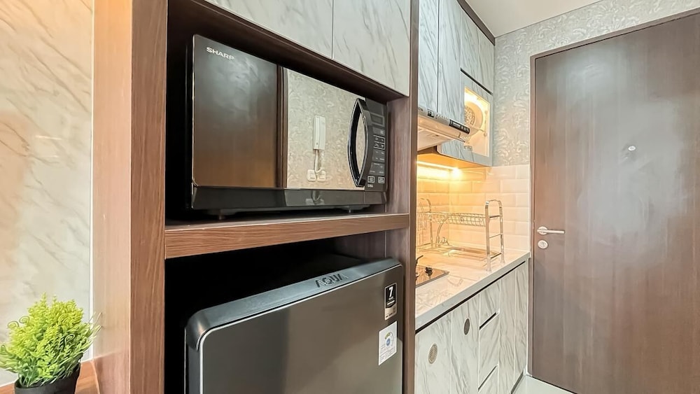 Earth Tone Studio Apartment At Transpark Bintaro