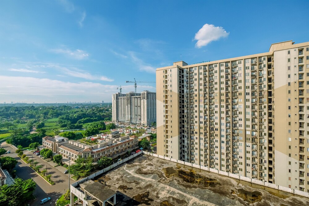 Warm and Cozy Design Studio at Podomoro Golf View Apartment