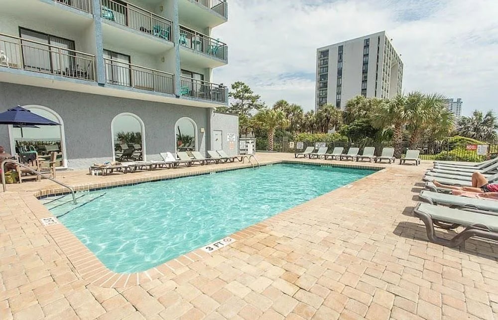 Beachfront Haven 1BR Condo with Balcony