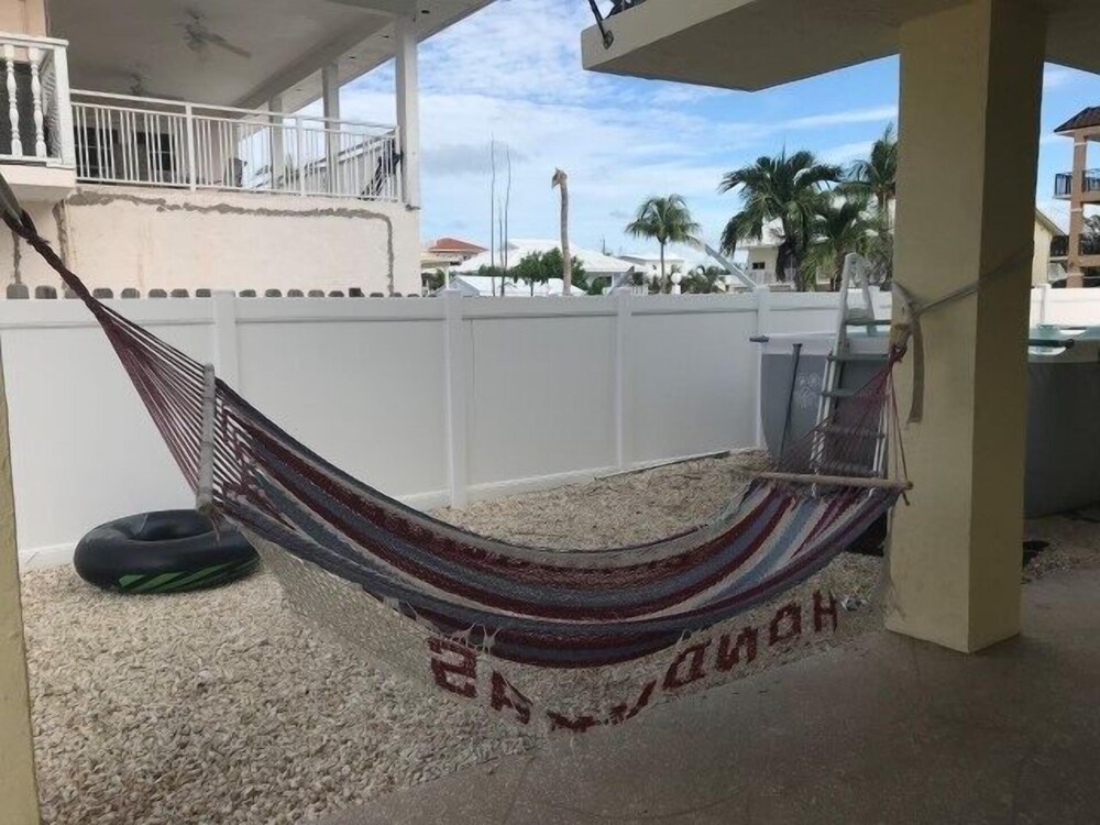 Beautiful Canal Front Home With Above Ground Pool, Dock And Fish Cleaning Station 4 Bedroom Home by RedAwning
