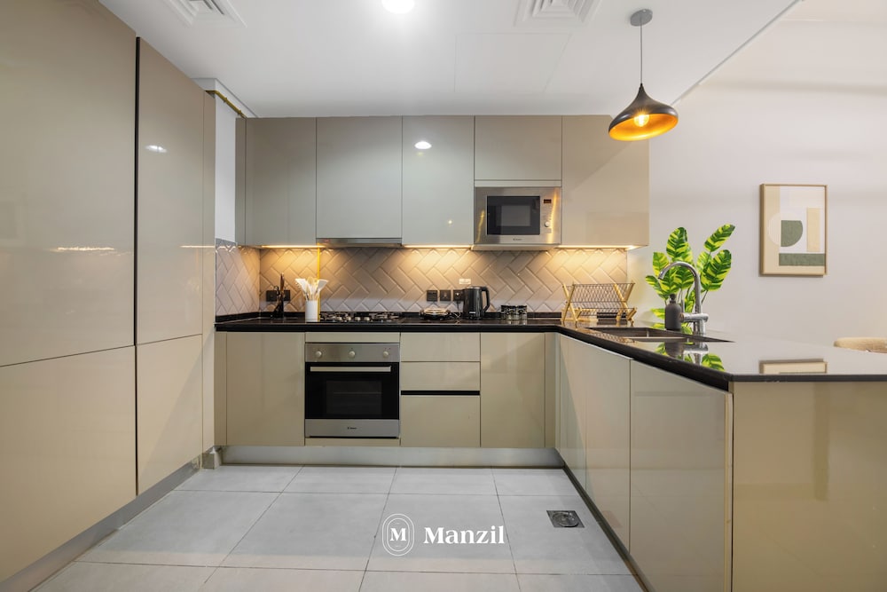Manzil-Stylish 1BR with Maid room in JVC