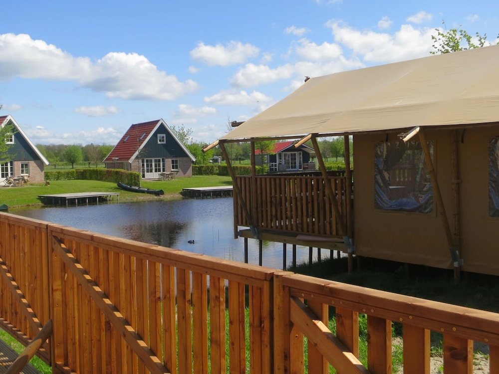 Campsite - Combined Tents With Kitchen and Bathroom Located Near a Pond