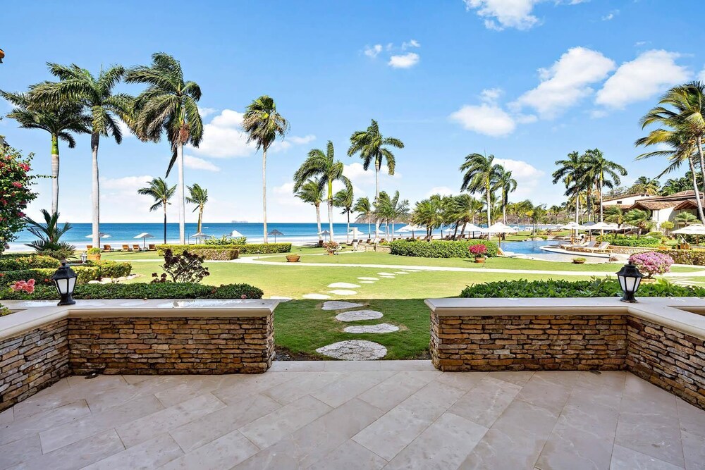 Luxury Beachfront Condo w/ High-End Wood Furnishings and Ocean Views in Exclusive Community view 4