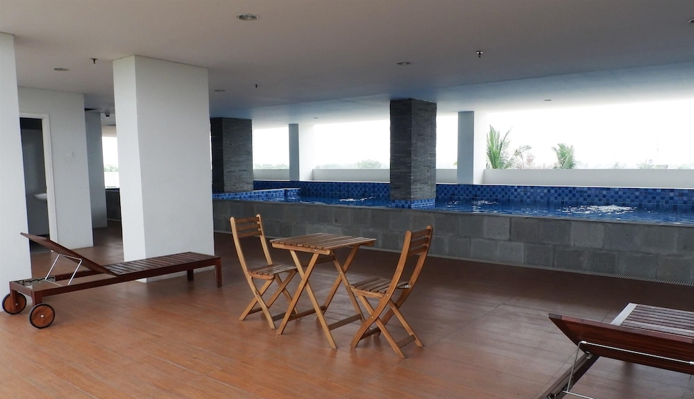 Homey And Cozy Living Studio At Poris 88 Apartment