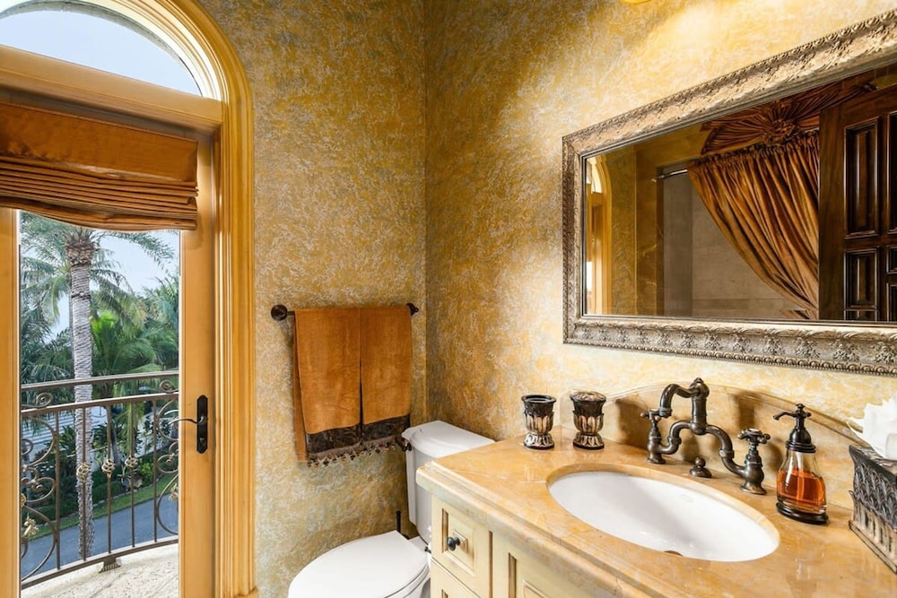 Luxurious 3-story Estate With Gym Pool Slide Private Beach and Lighthouse Views