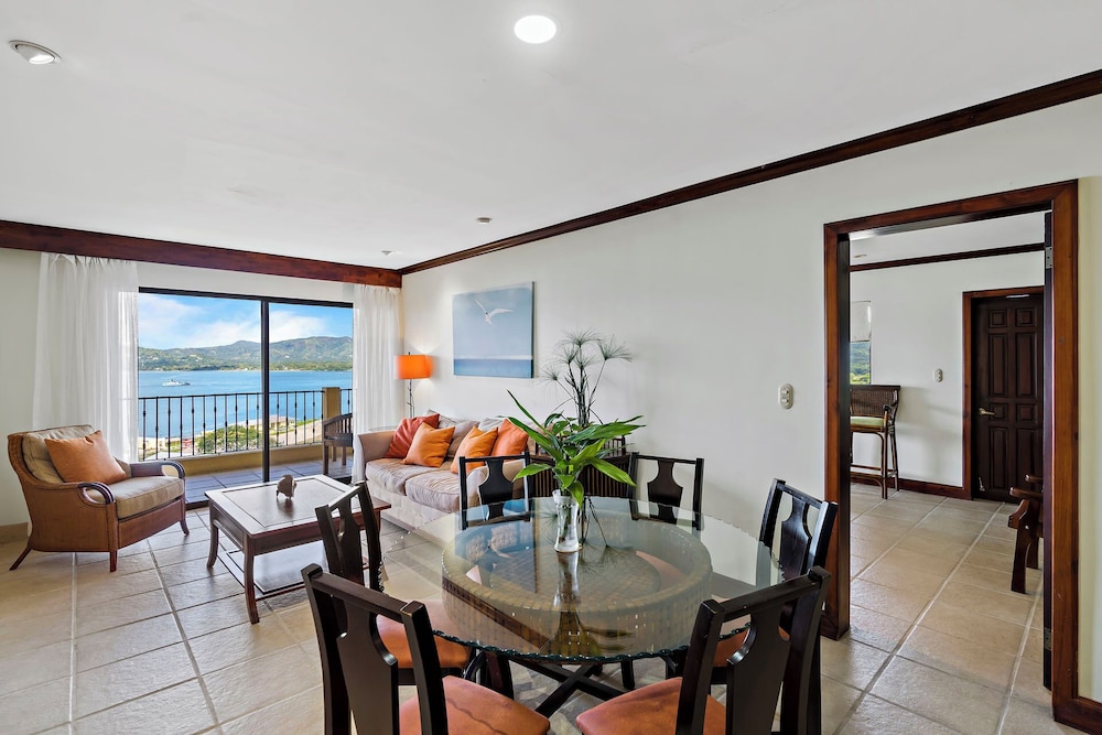 Remodeled Top-Floor Condo with Stunning Wrap-Around Balcony Offering Mountain, Ocean & Marina Views