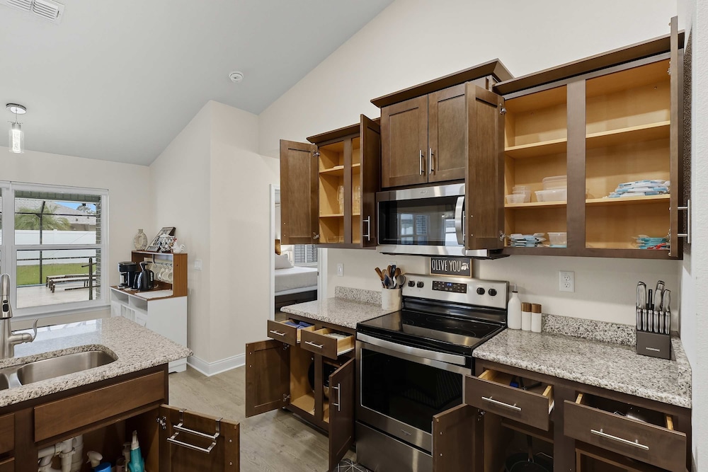 Modern 4BR Retreat Near Beach Heated Pool
