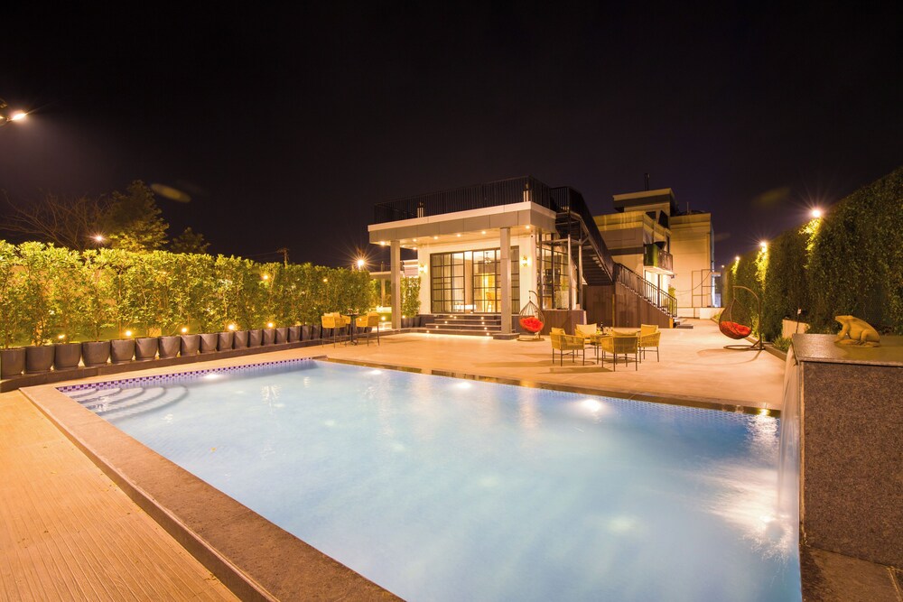 ELIVAAS Ibiza Luxe 4-BHK Farmhouse