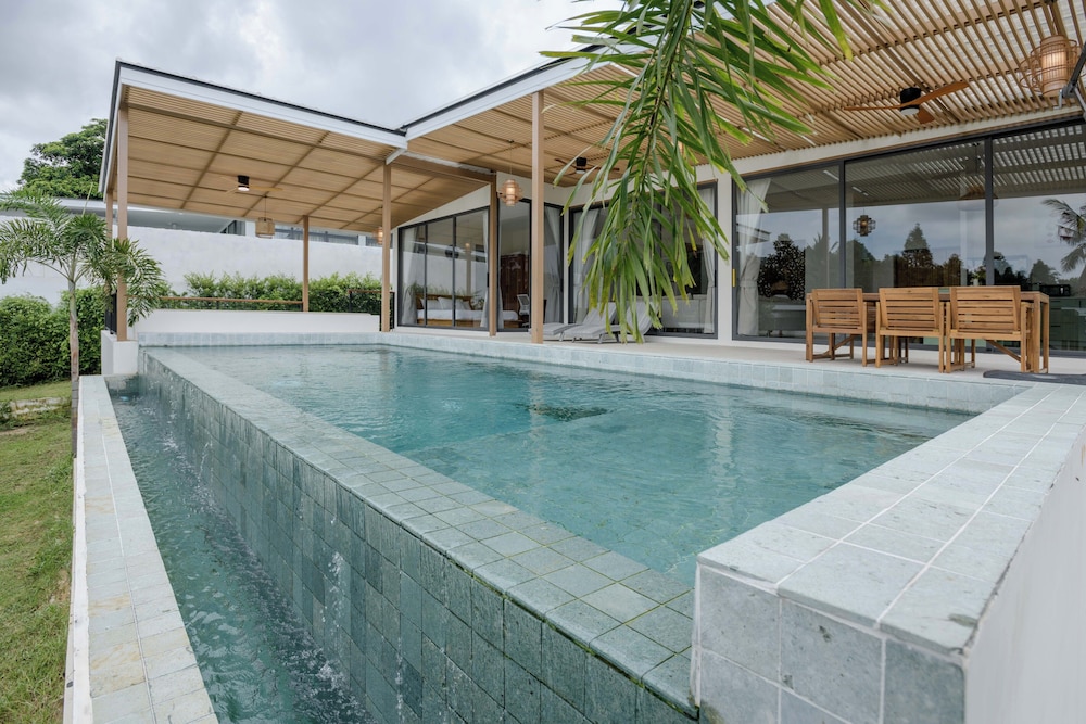 Tropical Poolside Retreat by Sea N' Rent