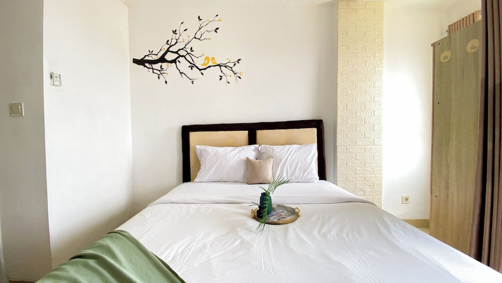 Homey And Cozy Living Studio At Poris 88 Apartment