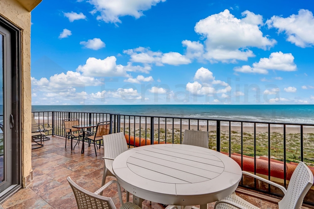 Spacious Oceanfront Penthouse Villa by RedAwning