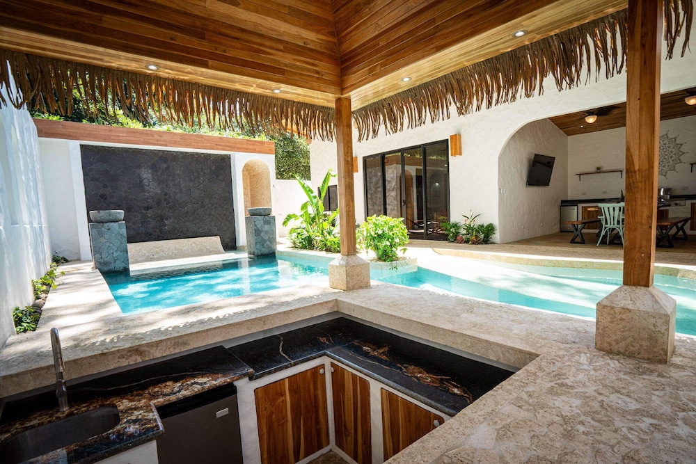 Bohemian Tropical Villa with a Tiki-Style Swimming Pool & Swim-Up Bar with an Attached Studio Apartment