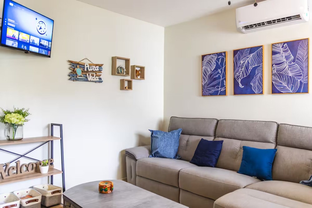 Cozy Condo with Panoramic Hillside Views from Rooftop Terrace and Short Walk to Beach