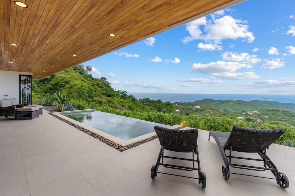 Mountainside Home with Modern Design, Sweeping Ocean Views & Private Swimming Pool