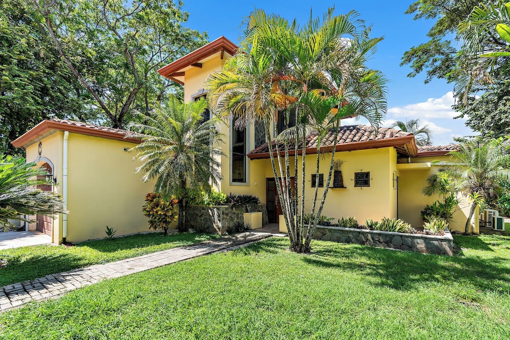 Inviting Home with Colorful Decor and Private Backyard Oasis with a Swimming Pool & Shaded Terrace