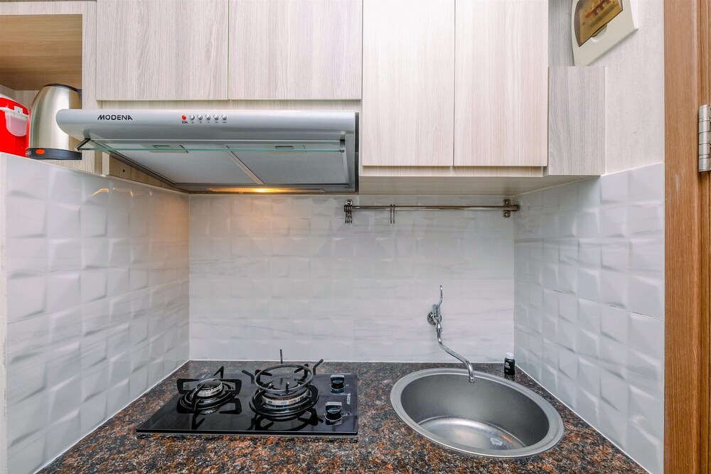 Homey Studio Room at Podomoro Golf View Apartment