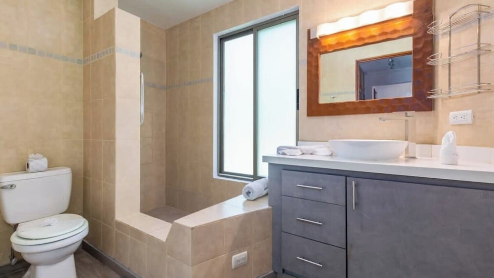 Elegant Condo with Brand-New Fixtures, Shaded Tropical Terrace, and Secluded Beach Access