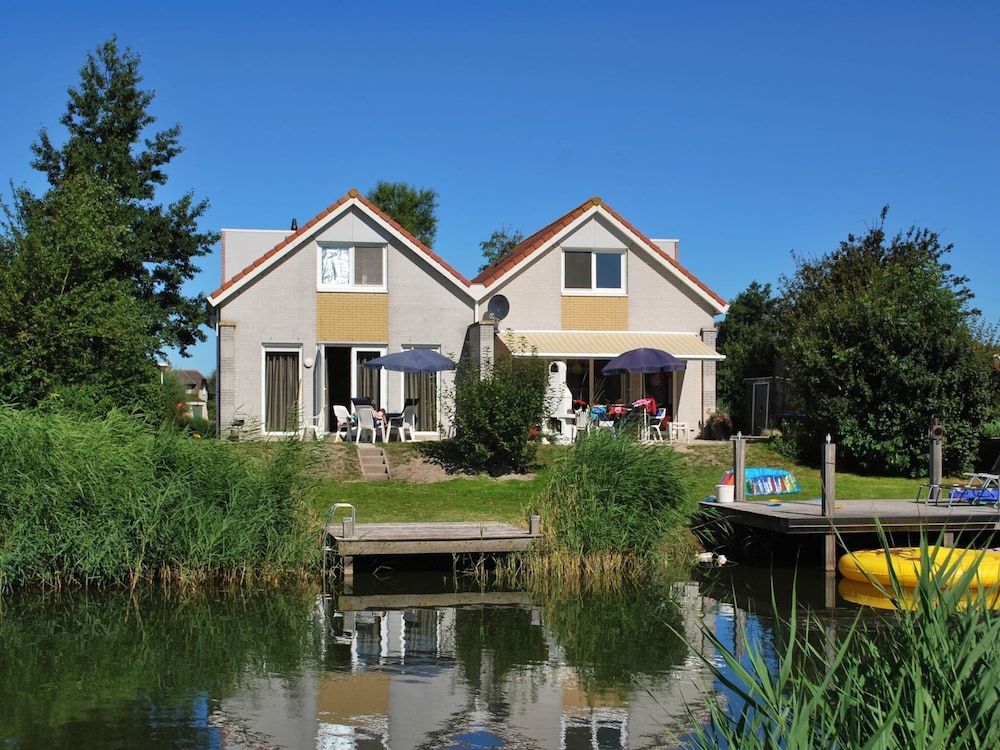 Nice Holiday Home on the Water in Friesland