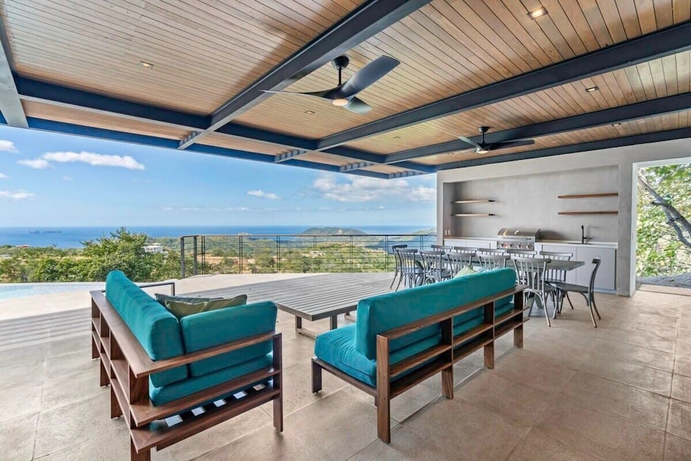 Luxurious Ultramodern Property with Private Suites, Infinity Pool, and Sweeping Ocean and Mountain Views