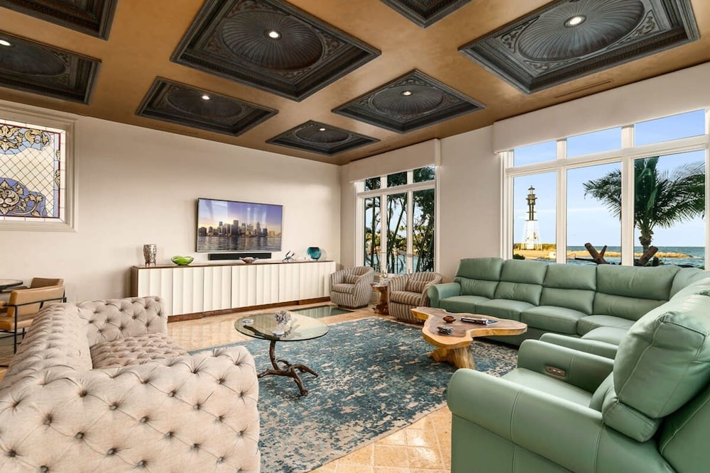 Luxurious 3-story Estate With Gym Pool Slide Private Beach and Lighthouse Views