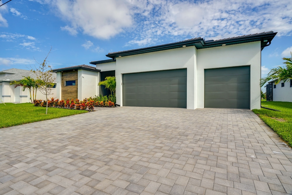 Pool & Outdoor Kitchen: Waterfront Cape Coral Home view 4