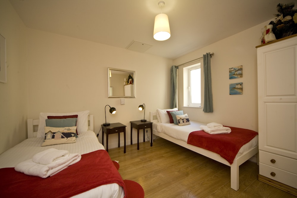 The Beach House & Porth Sands Apartments