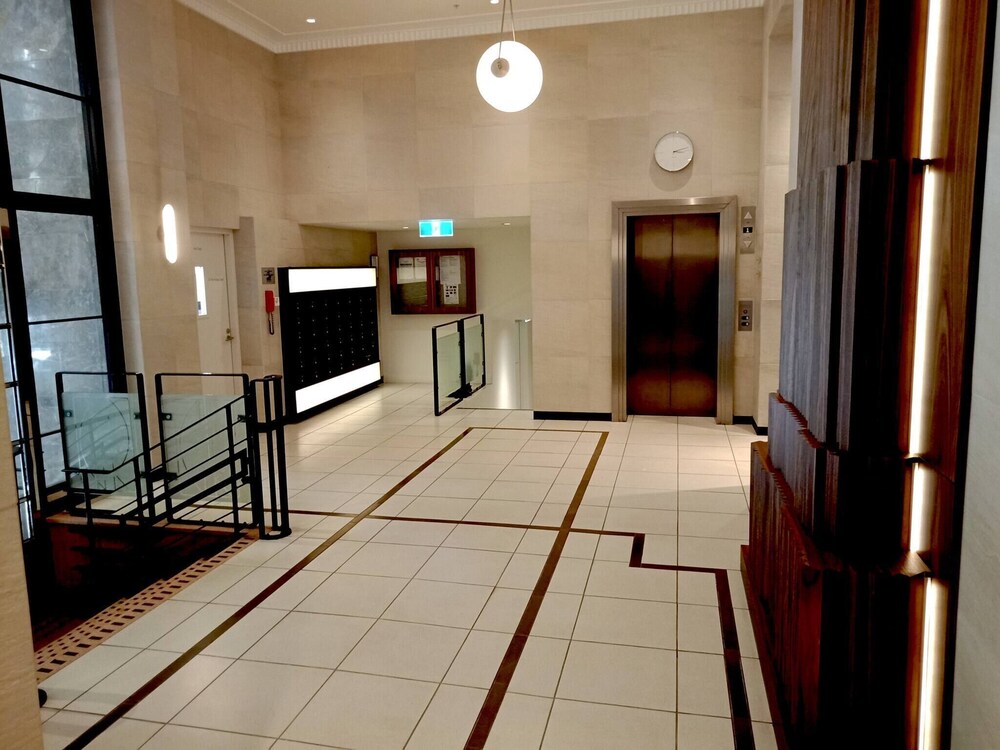 Unwind in Style at Melbourne's Historic Art Deco Apartment With Pool Gym Carpark