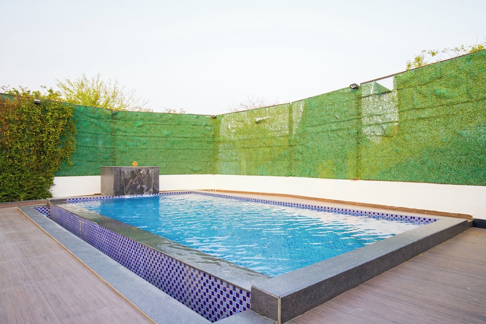 ELIVAAS Ibiza Luxe 4-BHK Farmhouse